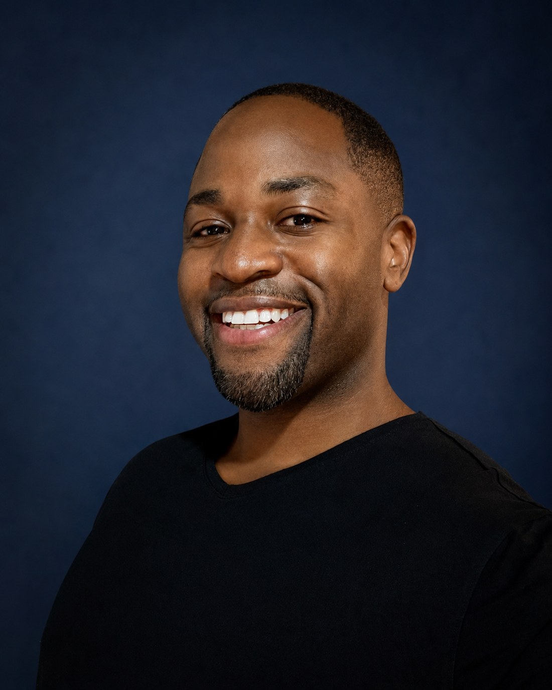 Jason L. Jones smiling in a professional portrait